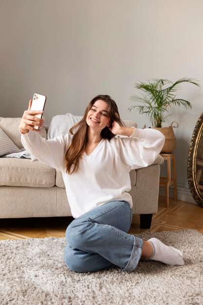 Woman with mobile taking selfie