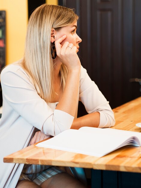 Woman with a mock-up magazine