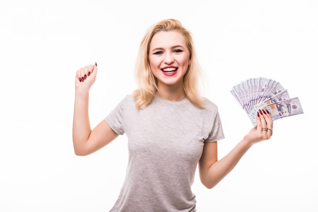 Woman with a money fan isolated over a white wall