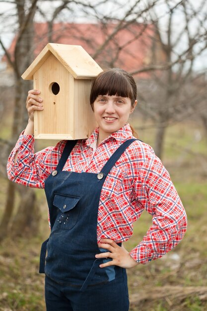 Woman with new birdhouse