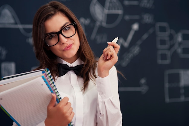 Woman with notebooks and chalk