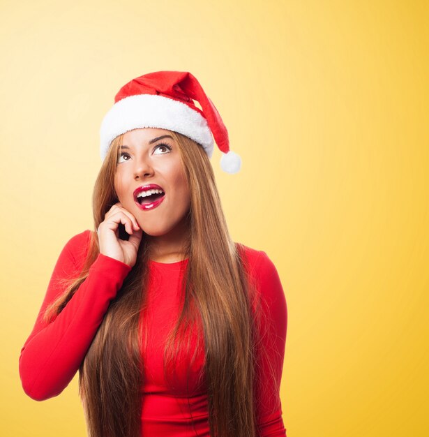 Woman with open mouth in a yellow background