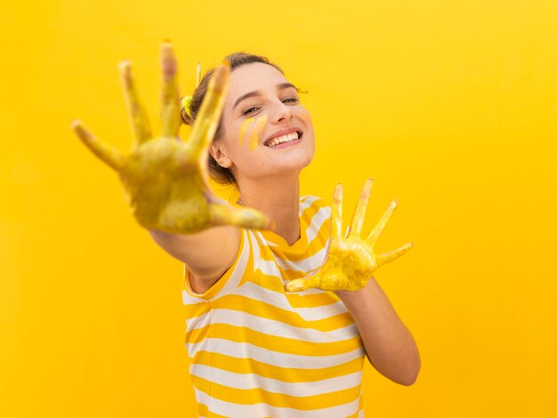 Woman with painted hands posing