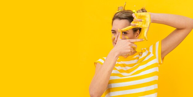 Woman with painted hands taking photo