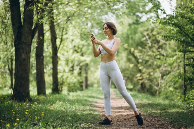 Woman with phone in sportswear