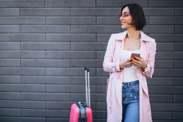 Woman with phone travelling