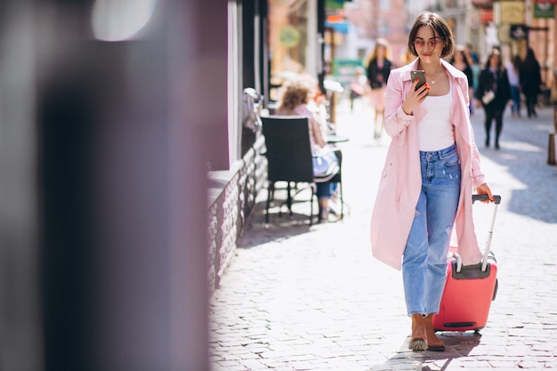 Woman with phone travelling