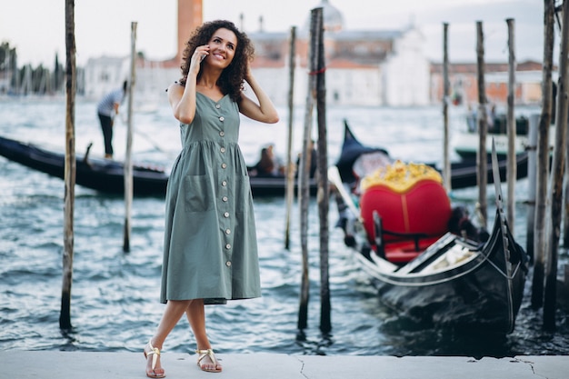 Free photo woman with phone on vacation in venice