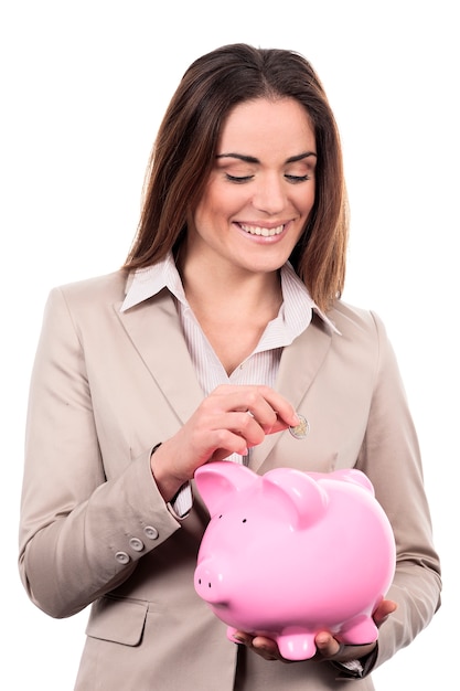 Woman with piggy bank and coin