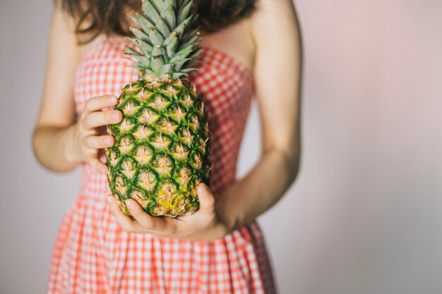 Woman with pineapple