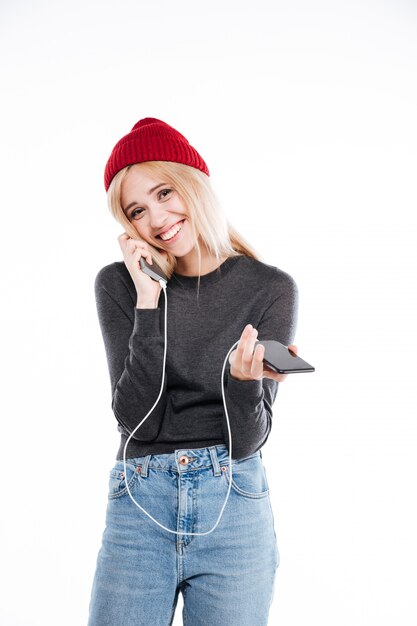 Woman with power bank and smartphone