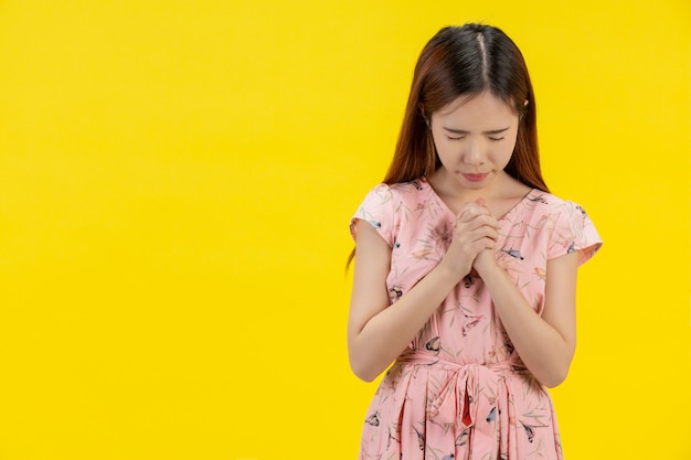 A woman with a prayerful hand