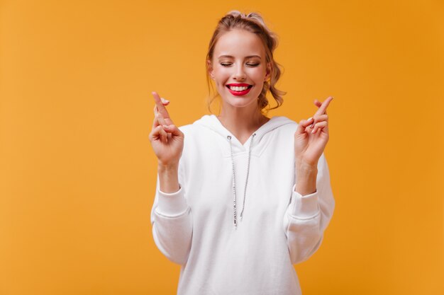 woman with pretty dimples on her cheeks with smile makes wish