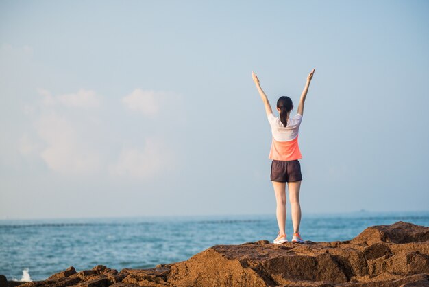 Woman with raised arms