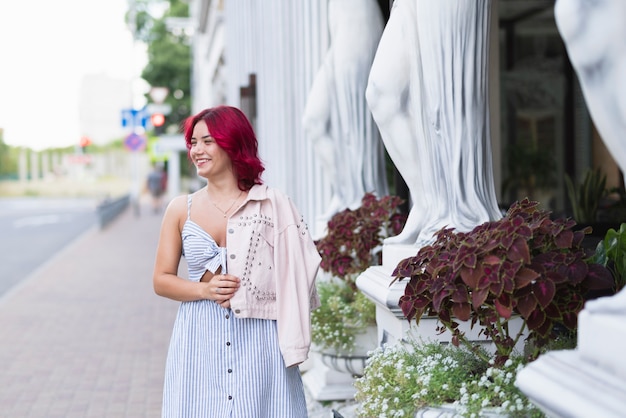 Free photo woman with red hair and flowers