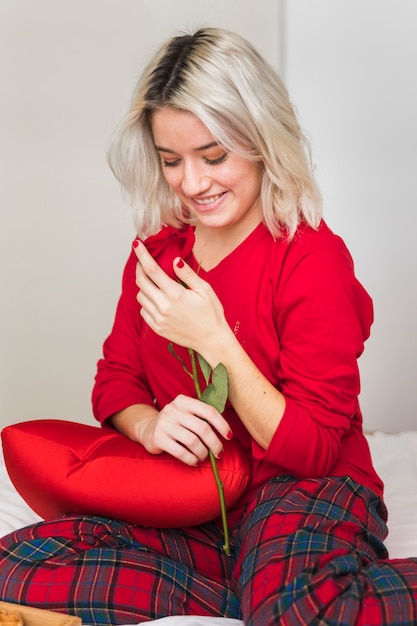 Woman with a red rose on valentines day