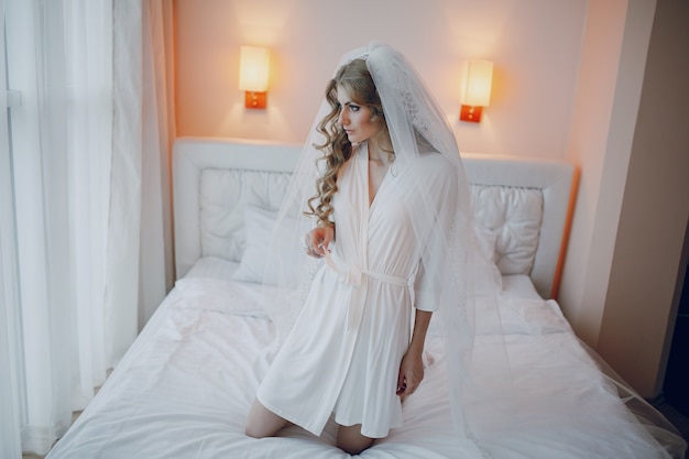 Free photo woman with robe and veil