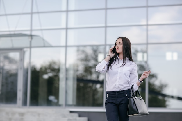 Woman with serious face talking on the phone