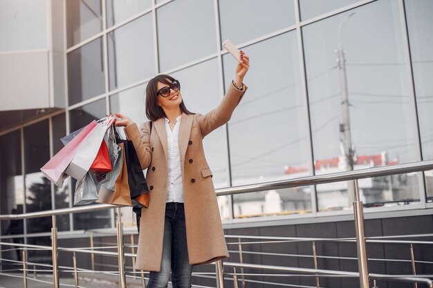 Woman with shopping bag in a city