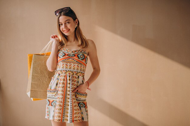 Woman with shopping bags isolated