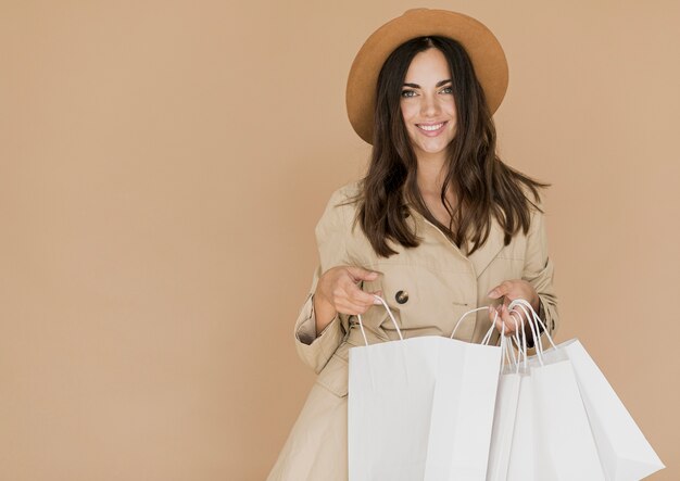 Woman with shopping bags looking at the camera