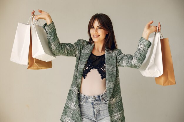 Woman with shopping bags on a white background