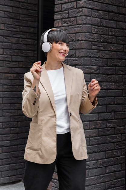 Woman with short hair listening to music