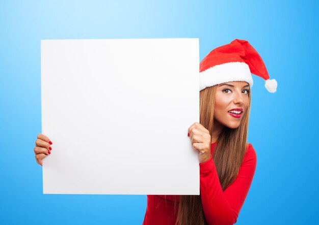 Woman with a sign in a blue background