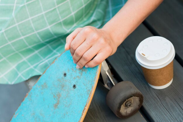 Woman with skateboard in urban city