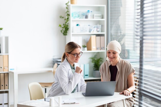 Woman with skin cancer talking with the doctor