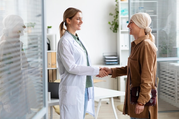 Woman with skin cancer talking with her doctor