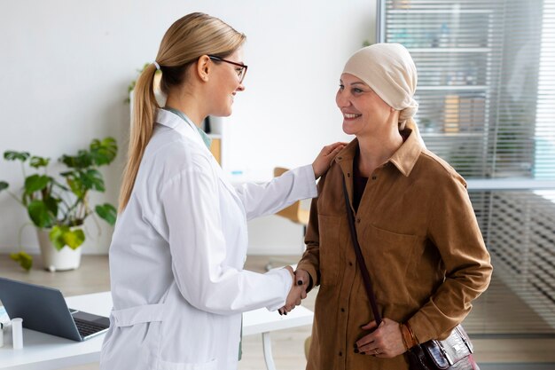 Woman with skin cancer talking with her doctor