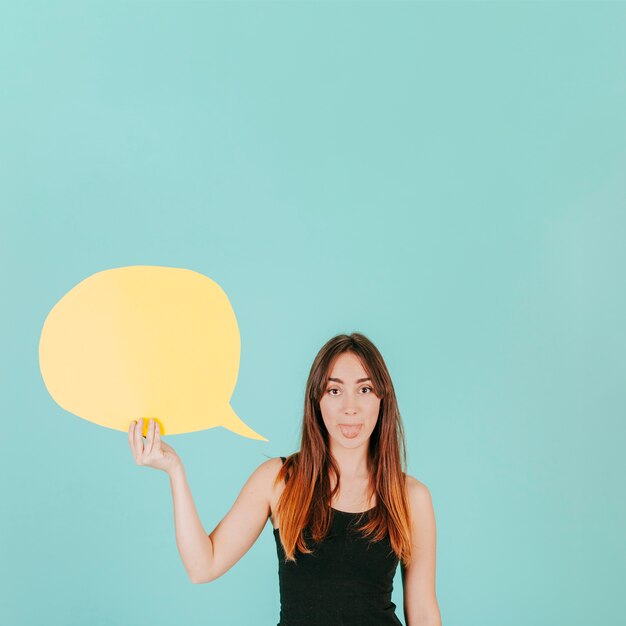 Woman with speech bubble showing tongue