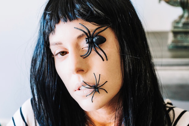 Woman with spiders on face