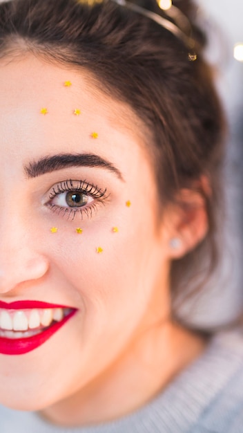 Woman with star spangles on face 