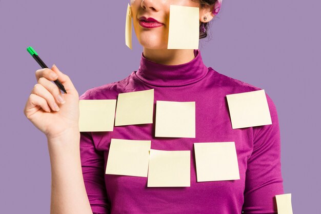 Woman with sticky empty notes on her