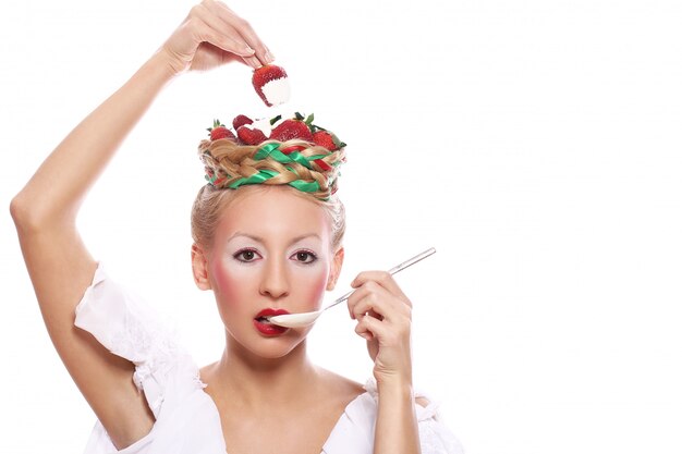 Free photo woman with strawberry in her hairstyle