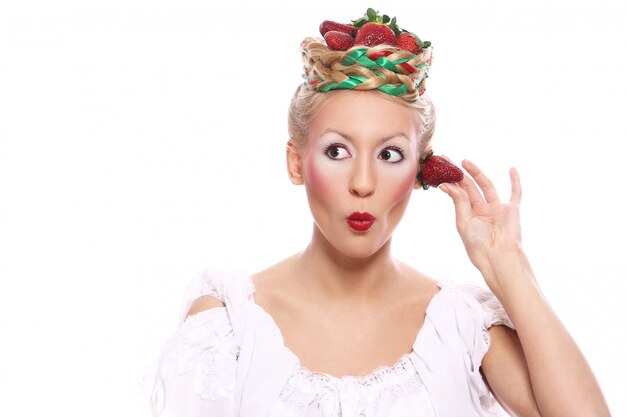 Woman with strawberry in her hairstyle