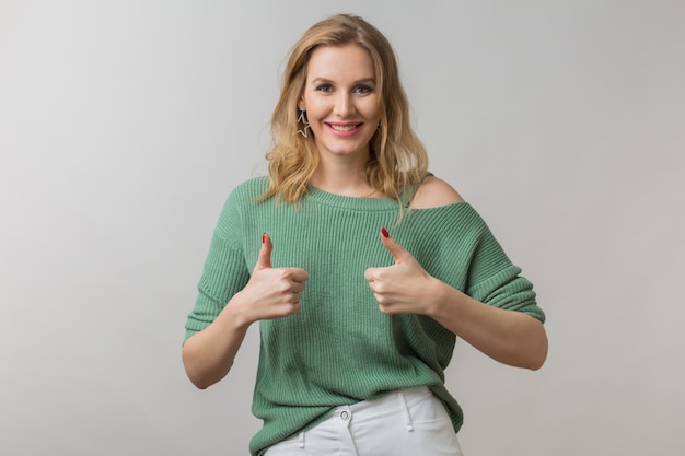 Free photo woman with stylish make-up and green sweater posing on pink