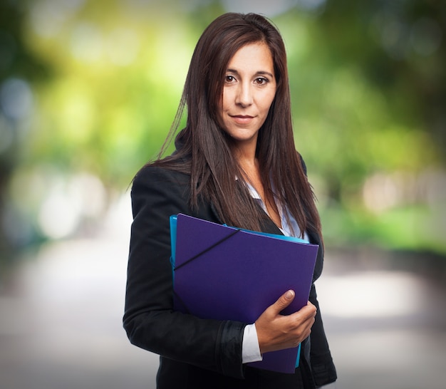 Woman with suit with folders