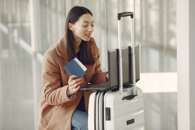 Woman with suitcase at the airport