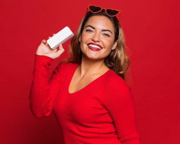 Free photo woman with sunglasses and box