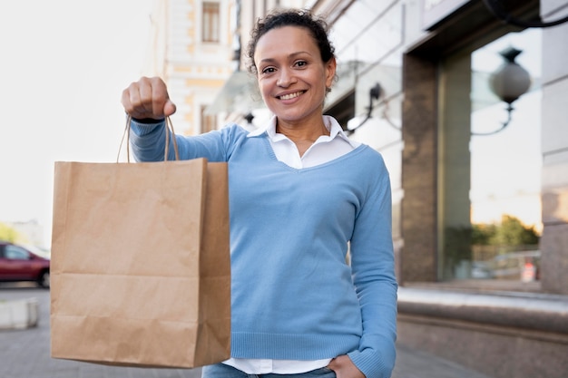 Free photo woman with takeaway food in paper bags