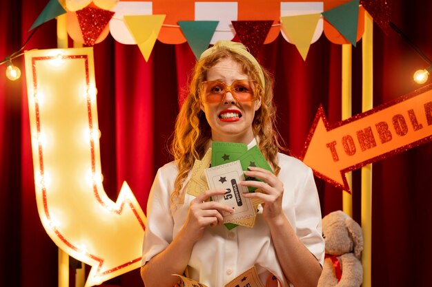 Woman with tombola tickets front view