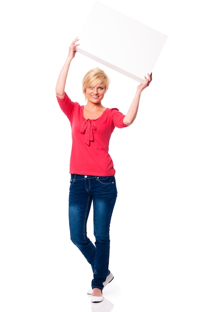 Free photo woman with white board above her head