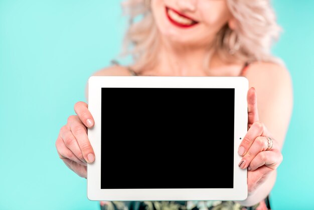 Woman with white digital tablet