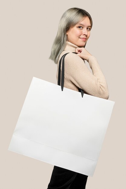 Woman with a white shopping bag with design space