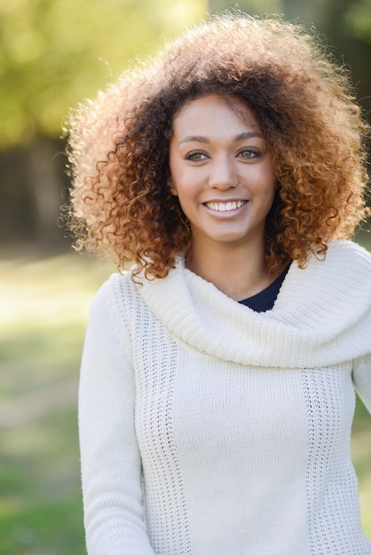 Woman with a white sweater smiling