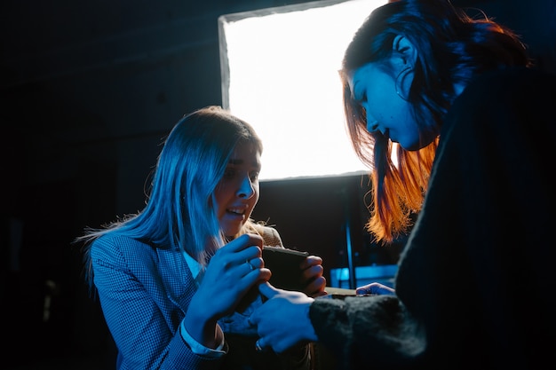 Woman and woman fortune teller with crystal ball