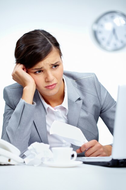 Woman at work with headache